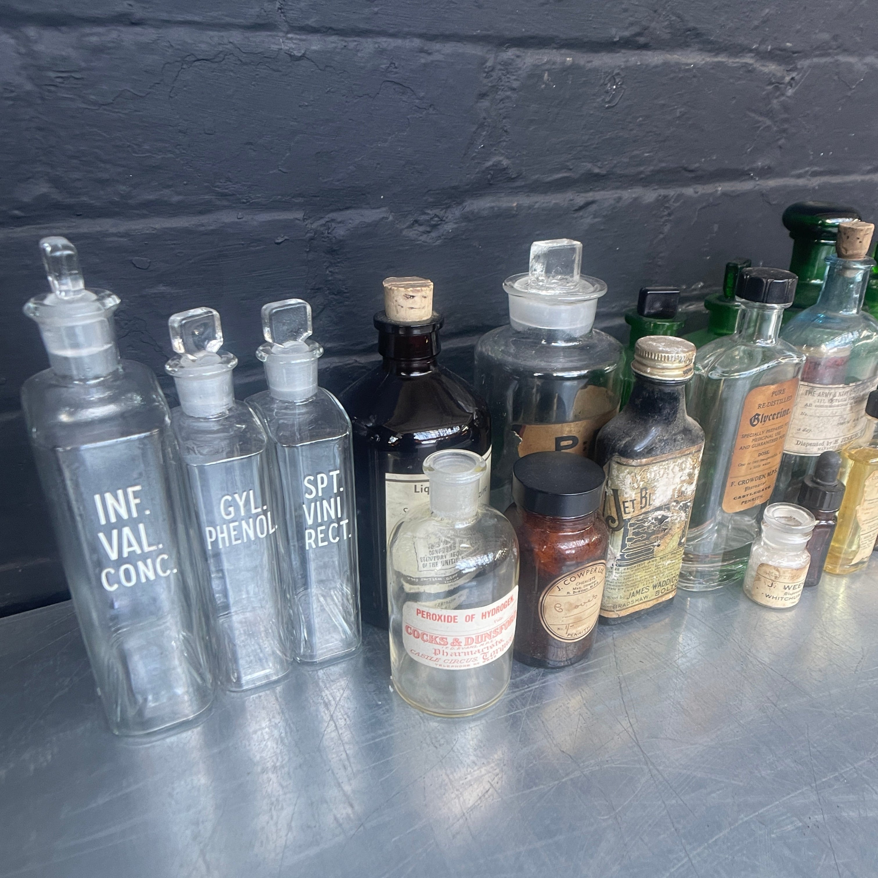 Industrial powerhouse props prop rental hire vintage movie film set dec green clear brown old vintage bottles drinks apothecary chemist 1890s 1900s 1910s 1920s 1930s 4