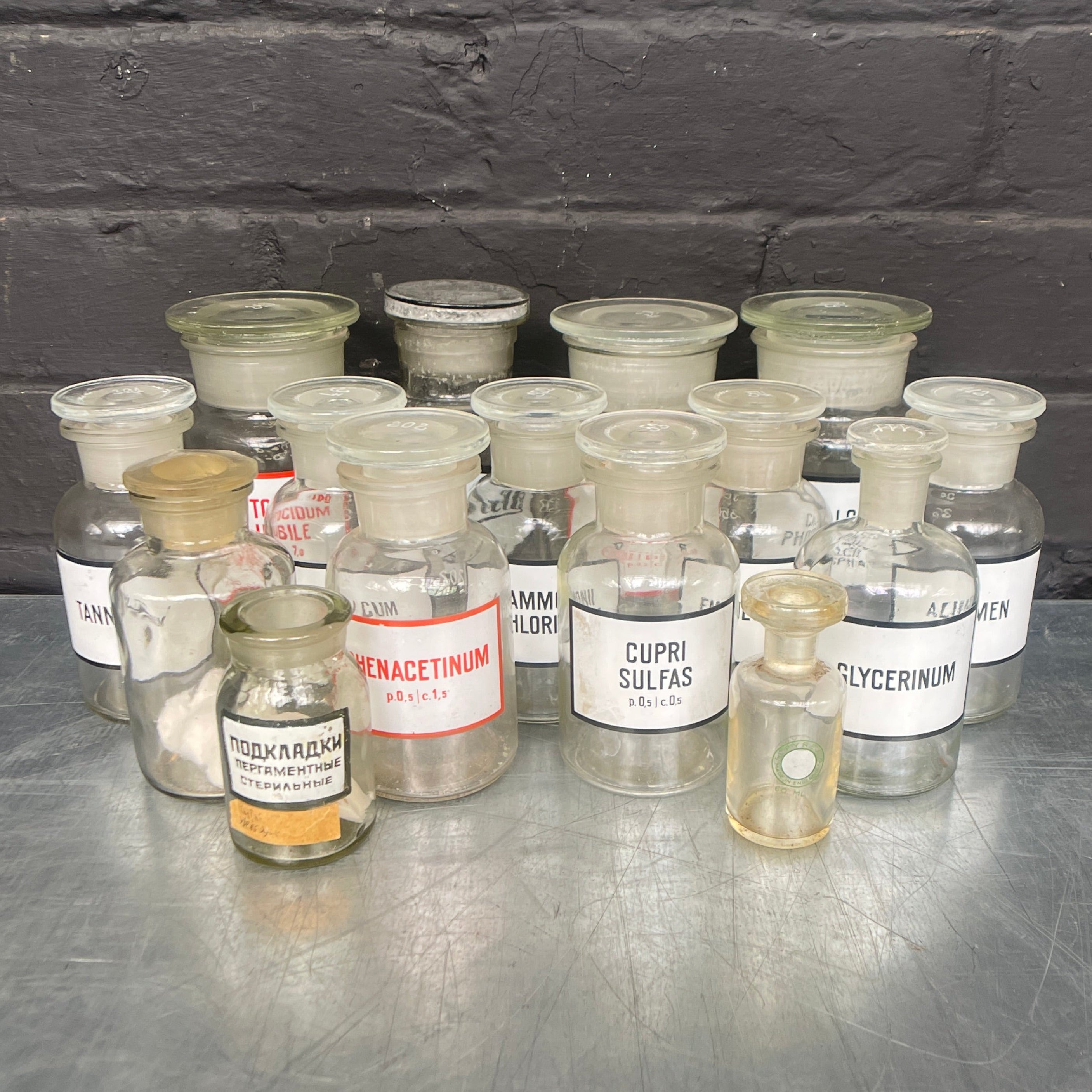 clear old vintage apothecary bottles chemist Industrial powerhouse props prop rental hire vintage movie film set dec