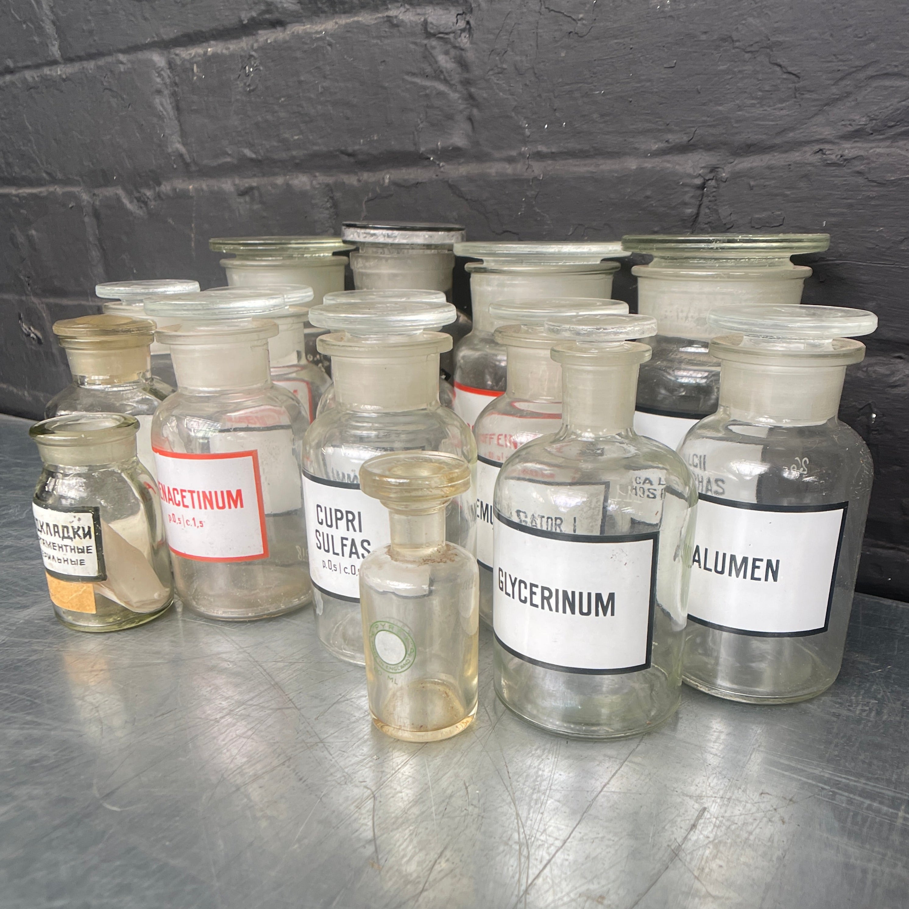 clear old vintage apothecary bottles chemist Industrial powerhouse props prop rental hire vintage movie film set dec 2