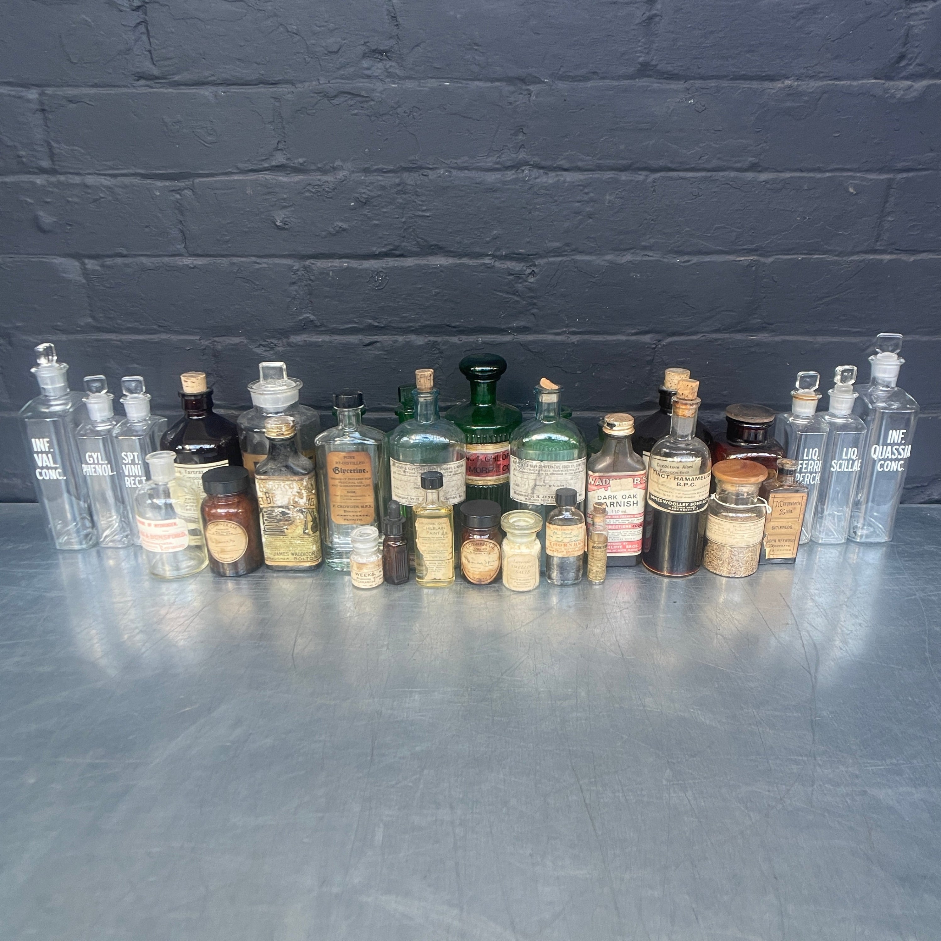 Industrial powerhouse props prop rental hire vintage movie film set dec green clear brown old vintage bottles drinks apothecary chemist 1890s 1900s 1910s 1920s 1930s 