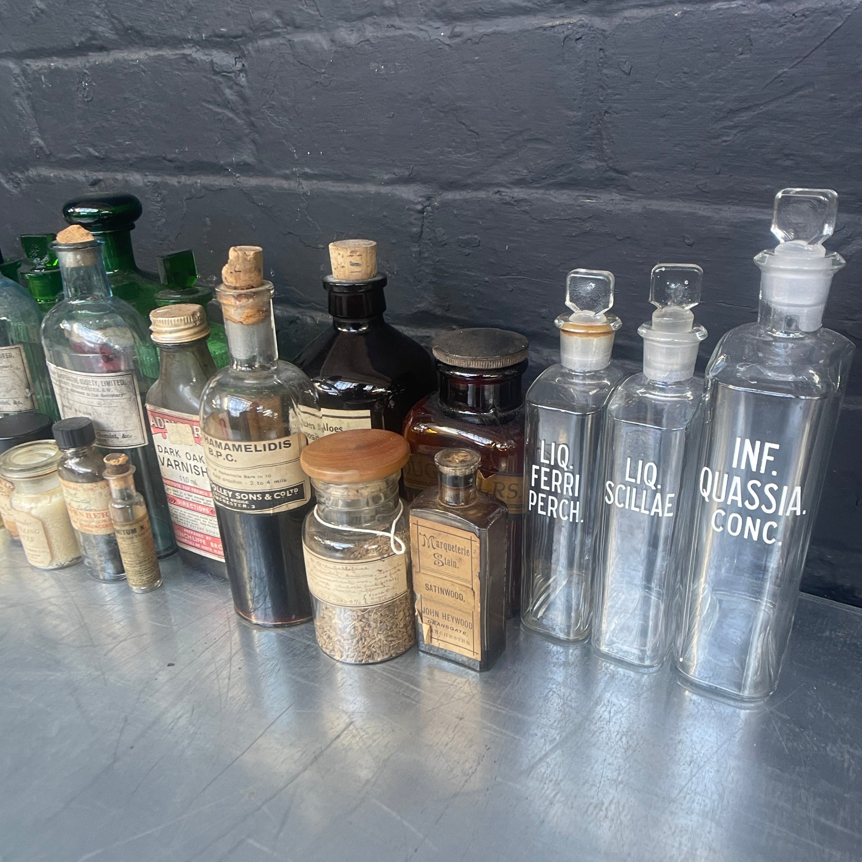 Industrial powerhouse props prop rental hire vintage movie film set dec green clear brown old vintage bottles drinks apothecary chemist 1890s 1900s 1910s 1920s 1930s 3