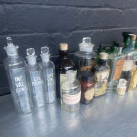 Industrial powerhouse props prop rental hire vintage movie film set dec green clear brown old vintage bottles drinks apothecary chemist 1890s 1900s 1910s 1920s 1930s 4