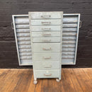 Industrial powerhouse props prop rental hire vintage movie film set dec opticians cabinet drawers green