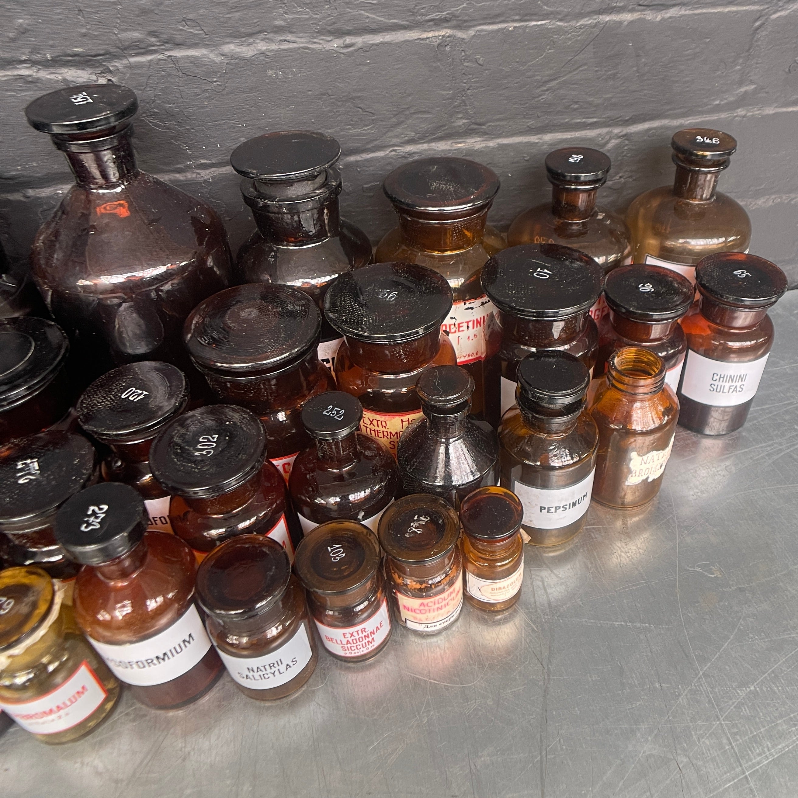 brown old vintage apothecary bottles chemist Industrial powerhouse props prop rental hire vintage movie film set dec 4