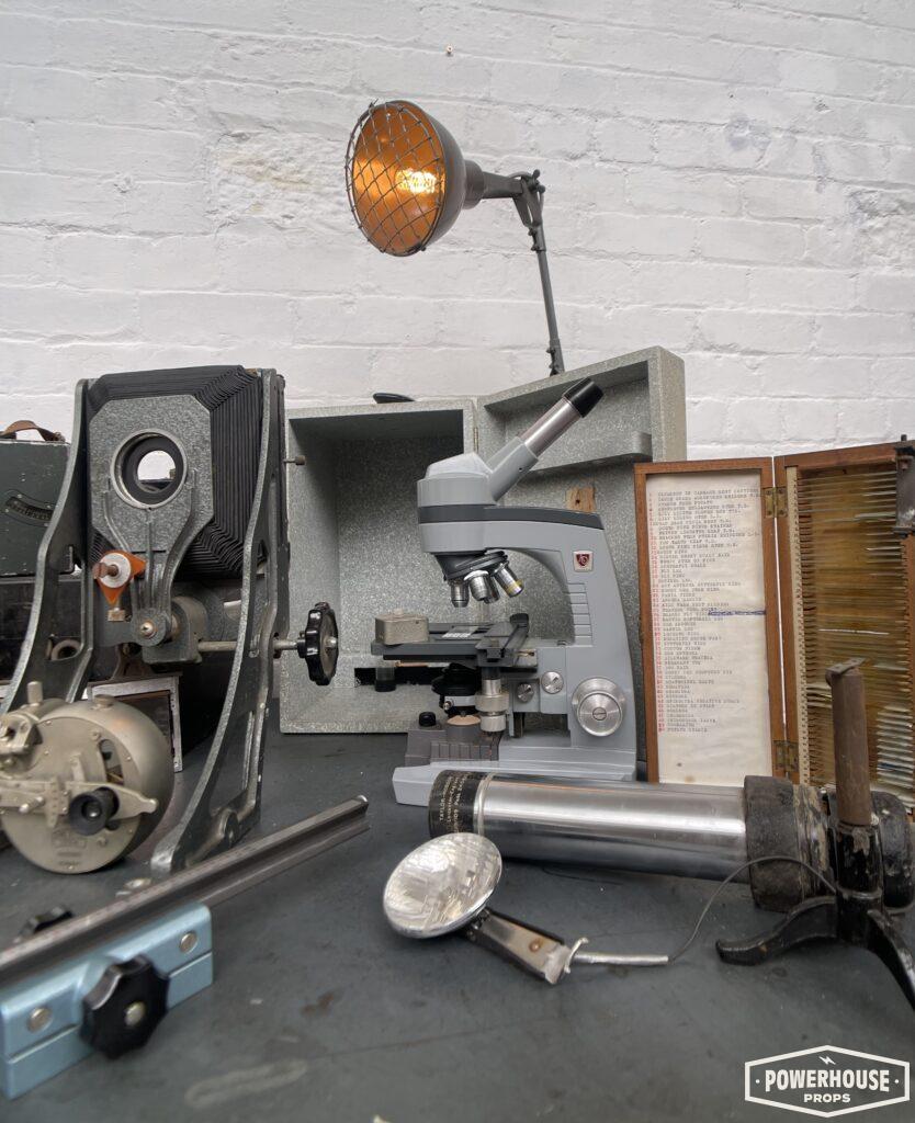 Powerhouse props vintage industrial projection optical lab specimen testing equipment electrical parts desk setup