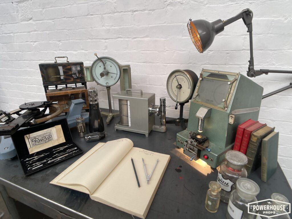 Powerhouse props vintage industrial projection optical testing equipment electrical parts desks setup