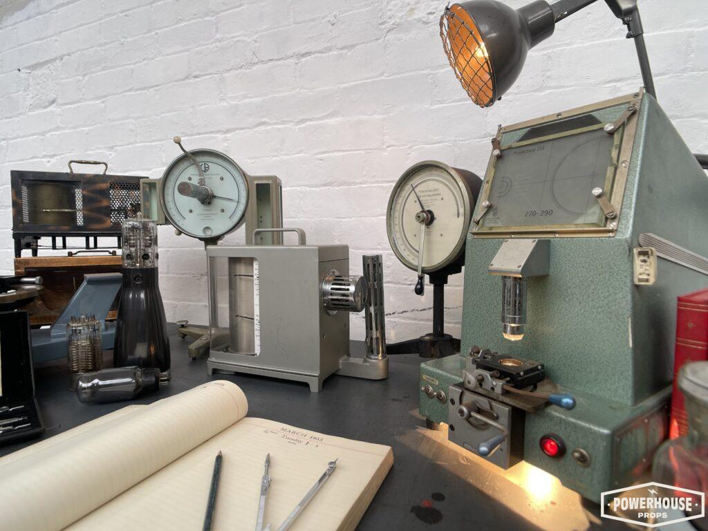Powerhouse props vintage industrial projection optical testing equipment electrical parts desks setup
